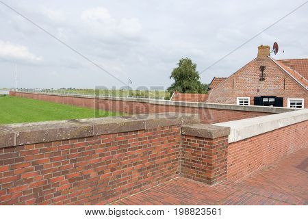 the small village of ditzum at the river ems
