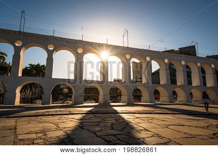 Sun Shines Through Landmark Lapa Arch in Rio de Janeiro City Downtown