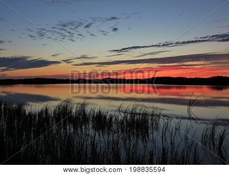 Red sky over the Jammerbugten Denmark. Sunset at Gronnestrand.