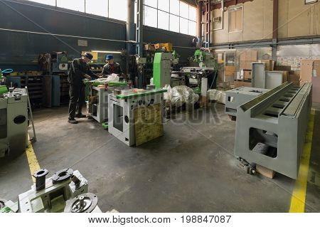 LIPETSK, RUSSIA - JUNE 15, 2017: Lipetsk Machine Tool Plant Workers are engaged in assembling a metal-cutting machine.