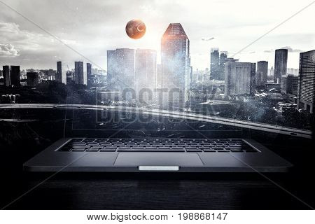 Laptop and construction concept. Mixed media