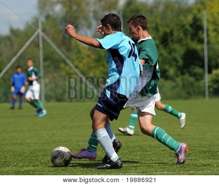 KAPOSVAR, HUNGARY - AUGUST 29: Laszlo Kalozdi (14) in action at the Hungarian National Championship under 17 game between Kaposvari Rakoczi and Bonyhad August 29, 2010 in Kaposvar, Hungary.