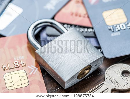 Credit cards and simle mechanical lock. Security concept.