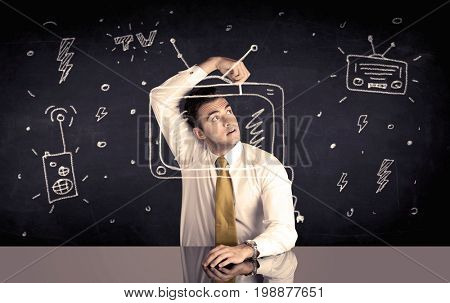 An elegant happy businessman drawing a television around his face, dreaming about becoming a famous actor or a programme presenter concept