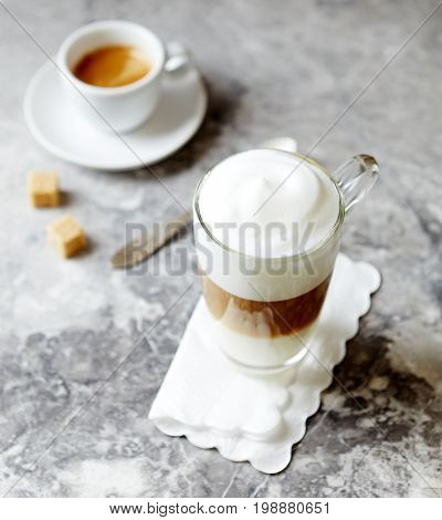 Glass of Latte Macchiato and a Cup of Espresso