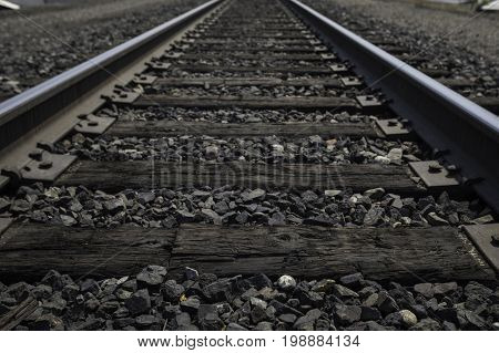 Low perspective of old wooden train tracks