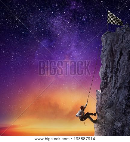 Businessman climb a mountain with a rope to get the flag. Achievement business goal and difficult career concept