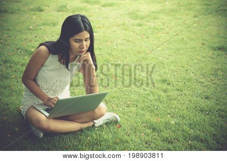 Attractive Young Girl With Laptop Outdoors. Beautiful Woman Working With Notebook. Student Working O