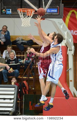 KAPOSVAR, HUNGARY - DECEMBER 11: Dan Werner (R) in action at a Hungarian Championship basketball game Kaposvar vs. Salgotarjan December 11, 2010 in Kaposvar, Hungary.