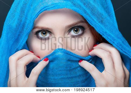 Female With Blue Burka Looking Mysterious