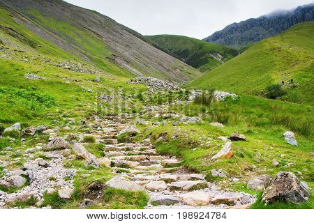 Path to Scafell Pike, view of the mountains, stream, Lake District, England, selective focus
