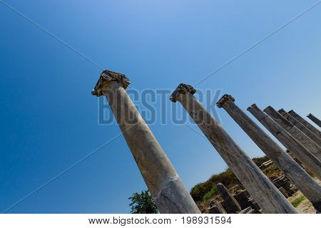 Ancient ruins of Perge on a background of blue sky. Turkey.
