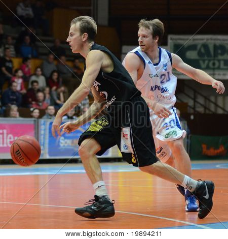 KAPOSVAR, HUNGARY - JANUARY 22: Laszlo Kalman (in black) in action at a Hungarian National Championship basketball game Kaposvar vs Szombathely January 22, 2011 in Kaposvar.