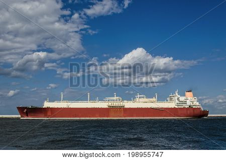 GAS CARRIER - A big ship sailing out of the harbor