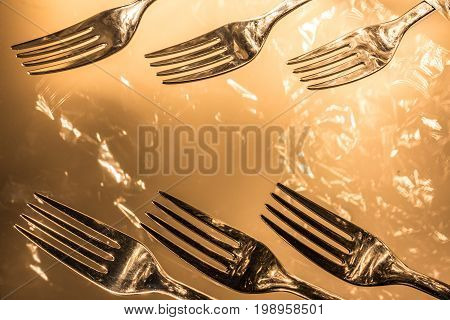 Many Forks  with reflections and light effects