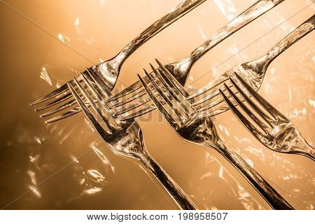 many Forks with reflections and light effects