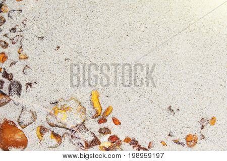 Amber. the pieces of amber in the sand on the beach. Sun stone natural mineral on the beach. Amber Shine on the beach. Amber Baltic sand