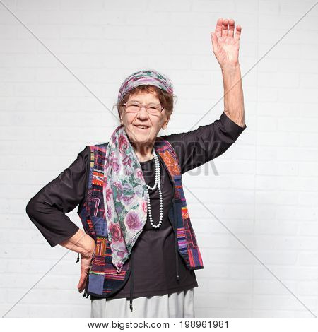 Elderly woman. Studio shot. Happy old female