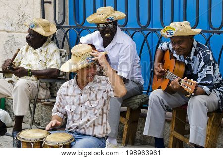 HAVANA April 2011 Cuba: very folkloric street musicians at Havana, playing Caribbean music for so many tourists visiting the Plaza de la Catredal