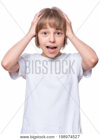 Portrait of little surprised girl excited scared. Shocked teenager in blank t-shirt, isolated on white background.