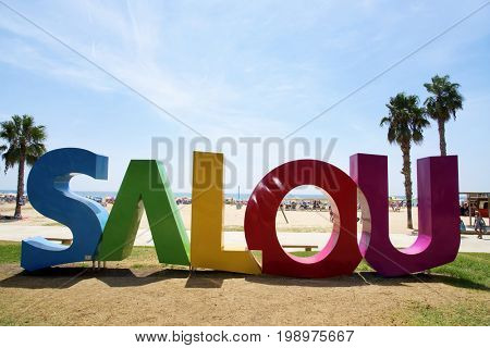 SALOU, SPAIN - AUGUST 3, 2017: A big Salou sign at the Llevant Beach in Salou, Spain. Salou is a major destination for sun and beach for European tourism with more than 50,000 accommodations