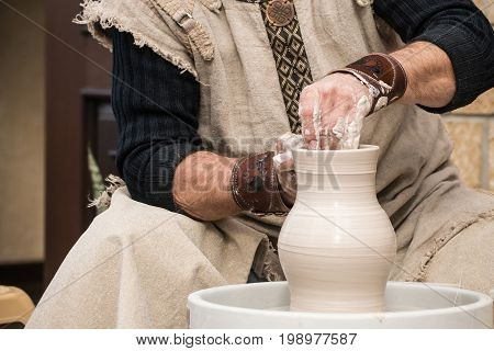 Hands of the old master at work