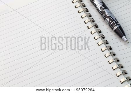World map pen with North America and South America on blank note pad with space for text - close up view