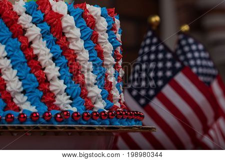 United States of America flags cake and blurred flags in background