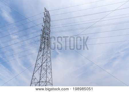 Wire Electric Telecom post and cable wth blue sky background