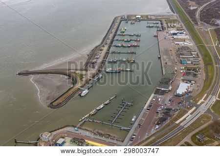 Aerial View Harbor And Industrial Park Lauwersoog At Dutch Coast Of Wadden Sea