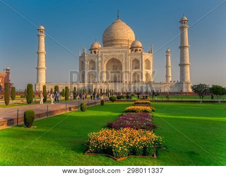 Agra, India - March 5 2018: Tourists Sighteseeing, Exploring And Admiring Famous The Taj Mahal