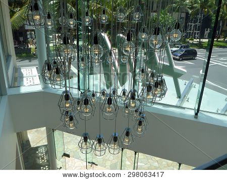 Waikiki - April 26, 2014: Lights Hang Inside H&m Store.  Hennes & Mauritz Ab Is A Swedish Multinatio