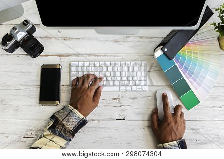 Architect Work Hard To Get The Best Job. Young Man Using A Computer, Hand Held Mouse And Keyboard, O