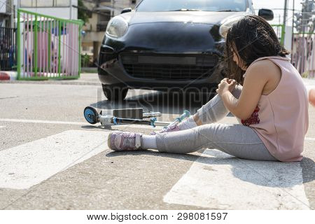 The Concept Of An Accident Caused By A Child Who Is Playing A Scooter And Being Hit By A Car, While 