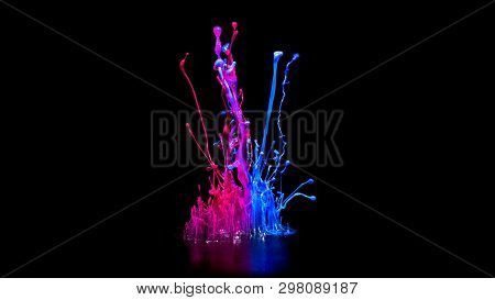 Pink And Bluel Paint Splashing On Audio Speaker Isolated On Black Background