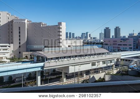 Odaiba, Japan - 11 April 2019 - Odaiba Monorail Trains Stop At A Station To Send And Pick Up Passeng