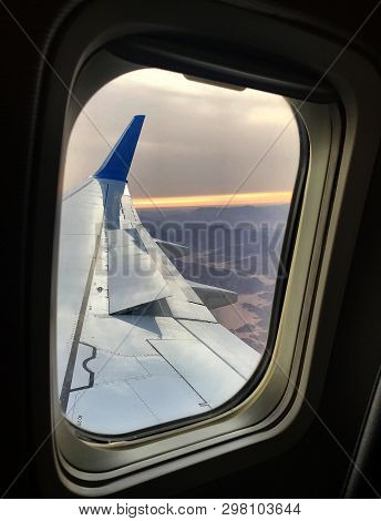 Beautiful View From Airplane Window, Large Wing Of Aircraft Shows Casement. Windows Aircraft Show Lo