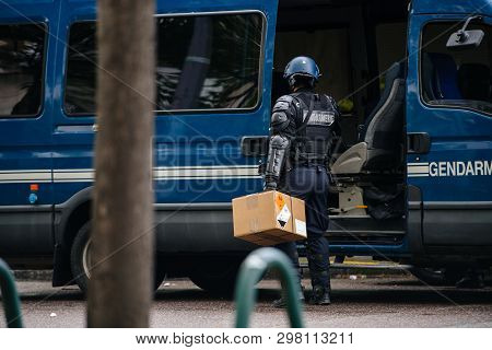 Strasbourg, France - Apr 28, 2019: Rear View Of French Police Officers Gendarmee Loading In Van Boxe