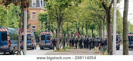 Strasbourg, France - Apr 28, 2019: Rear View Of Squadron Of Police Officers Securing The Alee De Rob