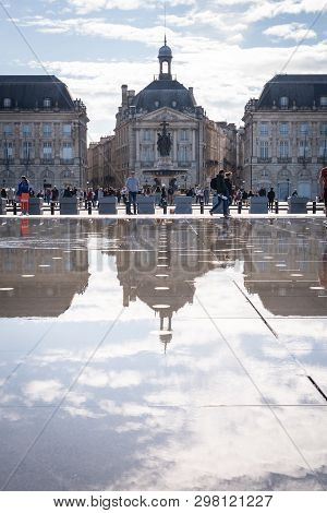 Bordeaux, France - April 14, 2019: The Place De La Bourse And The Water Mirror Of The Bordeaux Quays