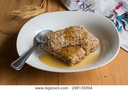 Wheat Cereal Bars Dribbled With Honey - Breakfast Cereal In A White Bowl