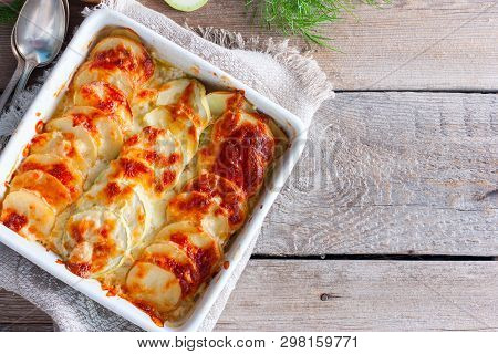 Graten From Courgettes And Young Potatoes With A Rosy Crust Of Mozzarella, Top View, Copy Space