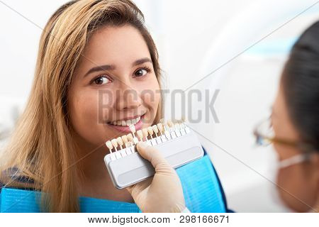 Pretty Smiling Young Asian Woman Having Teeth Whitening Procedure