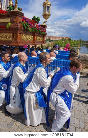 Merida, Spain. April 2019: A Group Of Bearers, Called Costaleros, Carrying A Religious Float