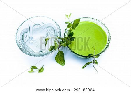 Best Home Remedy Or Treatment To Reduce Rashes Isolated On White Consisting Of Mint And Water In A G