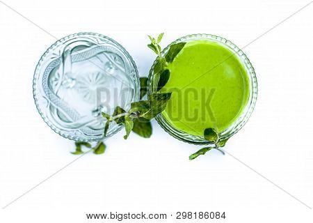 Best Home Remedy Or Treatment To Reduce Rashes Isolated On White Consisting Of Mint And Water In A G