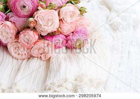 Female Dress And Jewellery With Fresh Rununculus Bouquet
