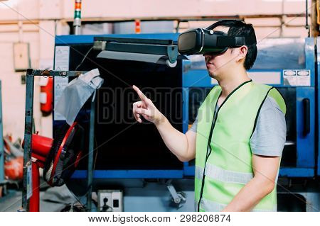 Industrial Factory And Manfacturing Engieering Worker Wearing Vr Goggle Headset Touching In Virtual 