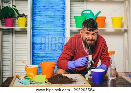 Gardener. Breeder Or Biologist With Soil And Microscope. Spring, Spring Work. To Plant Flowers. New 