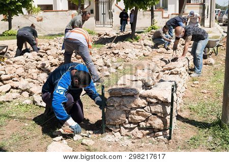 Maruggio, Italy - April 28, 2019 - Construction Of A Low Wall - Old Traditional Apulian Architectura